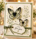 Green floral card with two black outlined butterflies, gold pearls, and just for you tag
