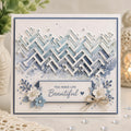 Blue greeting card with layered geometric brick pattern, white flowers, and beautiful sentiment
