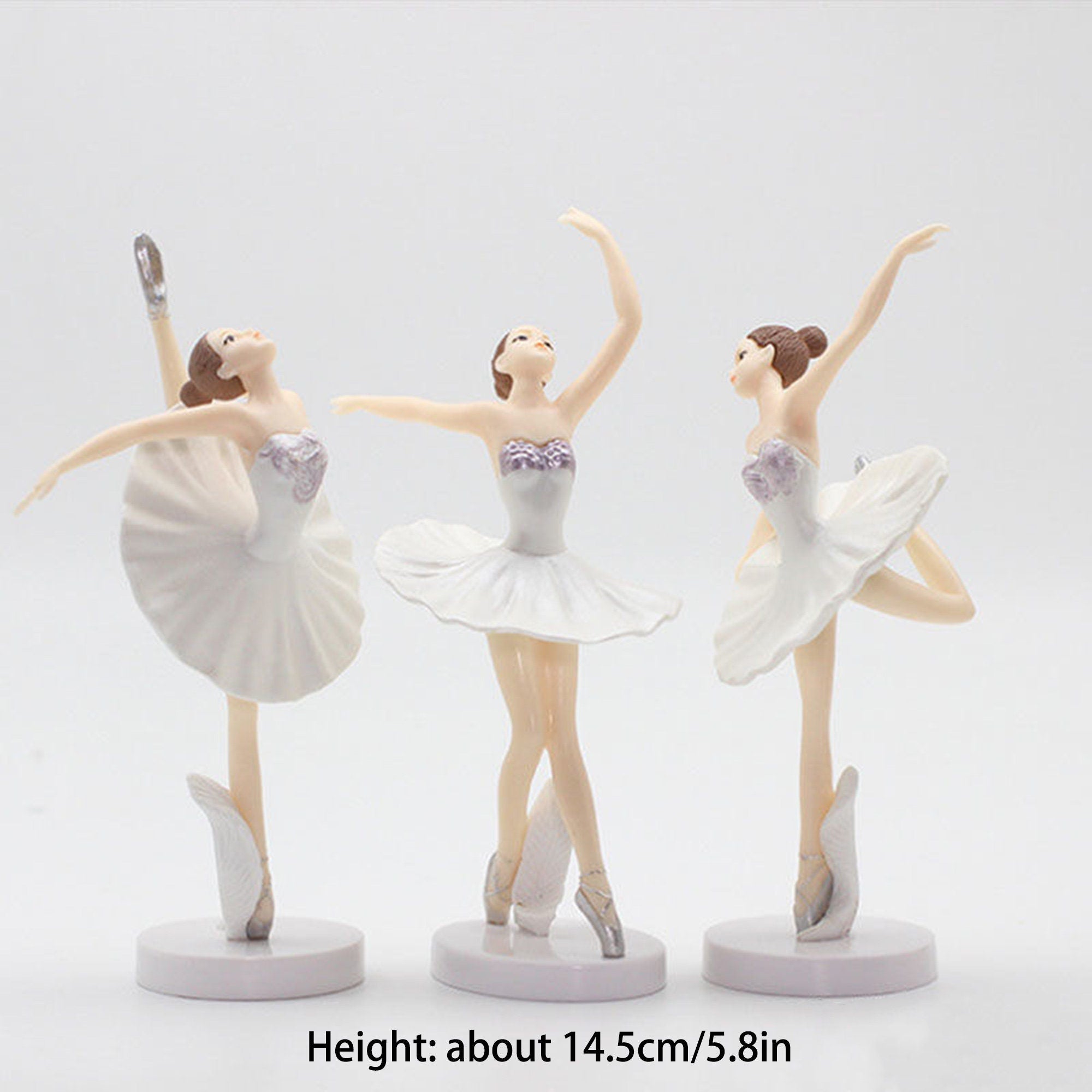 Three white porcelain ballerina figurines with purple accents. Each figurine is about 14.5 inches tall and is posed in a different ballet position.  Height: about 14.5cm/5.8in