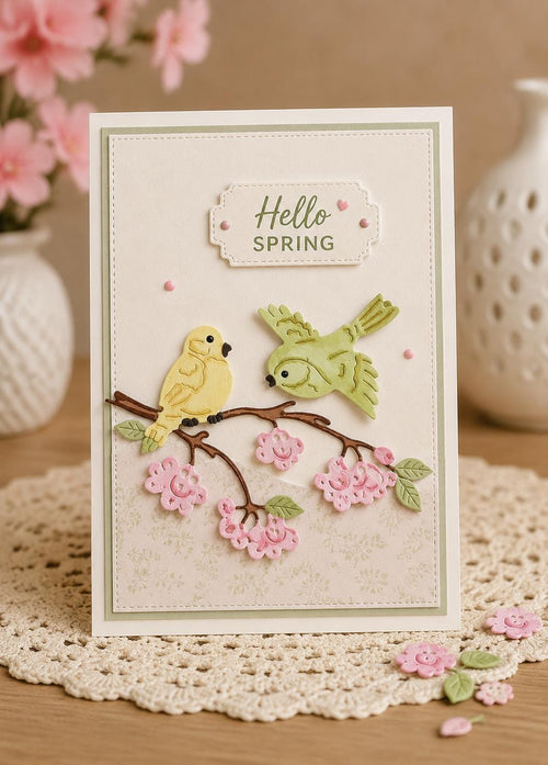 Spring card with two yellow birds on flowering branch and hello spring greeting