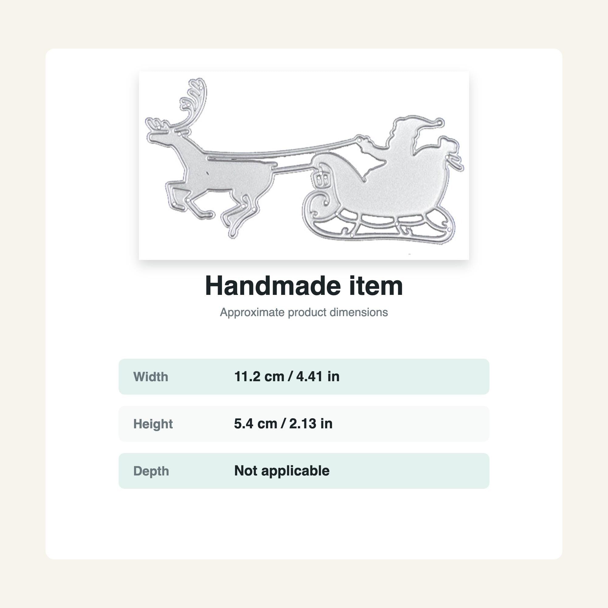 A silver-colored metal die cut of Santa Claus in a sleigh being pulled by a reindeer. The die cut is labeled "Handmade item" with dimensions of 4.41 inches wide and 2.13 inches high.