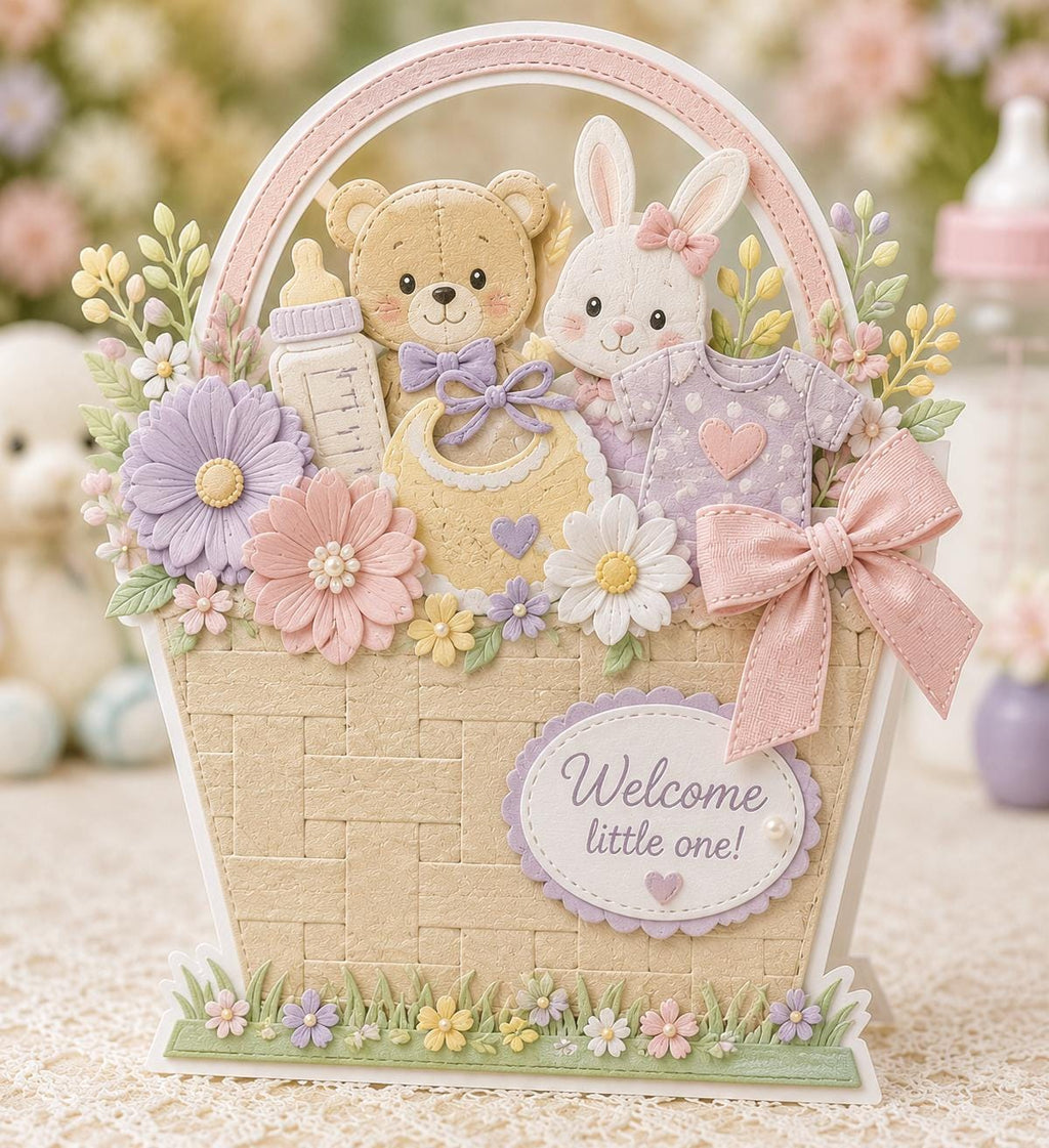 Pastel baby gift basket card with teddy bear, bunny, clothes, flowers, and bow