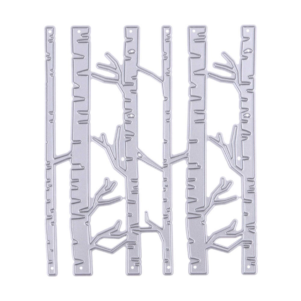Silver metal cutting dies shaped like tall birch trees and branches
