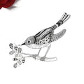 Black line art clear stamp illustration of a patterned bird perched on a leafy branch