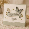 Green butterfly birthday card with curled banner greeting and leaf sprigs