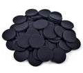 Pile of black non-woven felt circles shown against a white background
