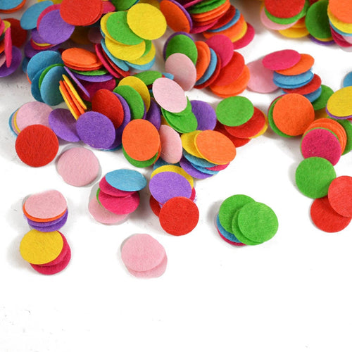 Mixed-color round felt circles scattered on a white background