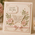 Pale pink card with ornate butterfly die cut, flowers, pearls, and especially for you greeting